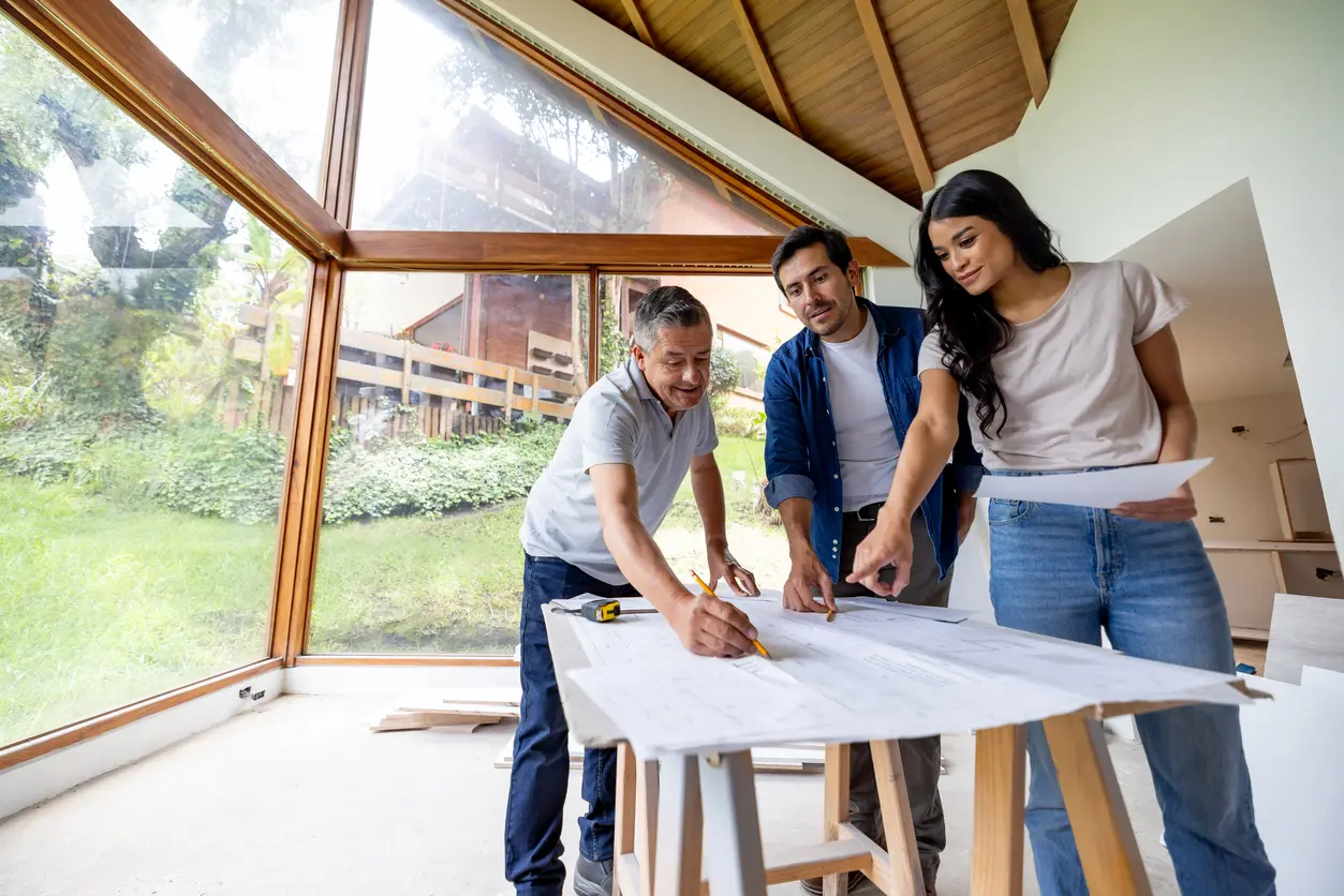 Homeowners reviewing remodeling plans with contractor in Prescott AZ