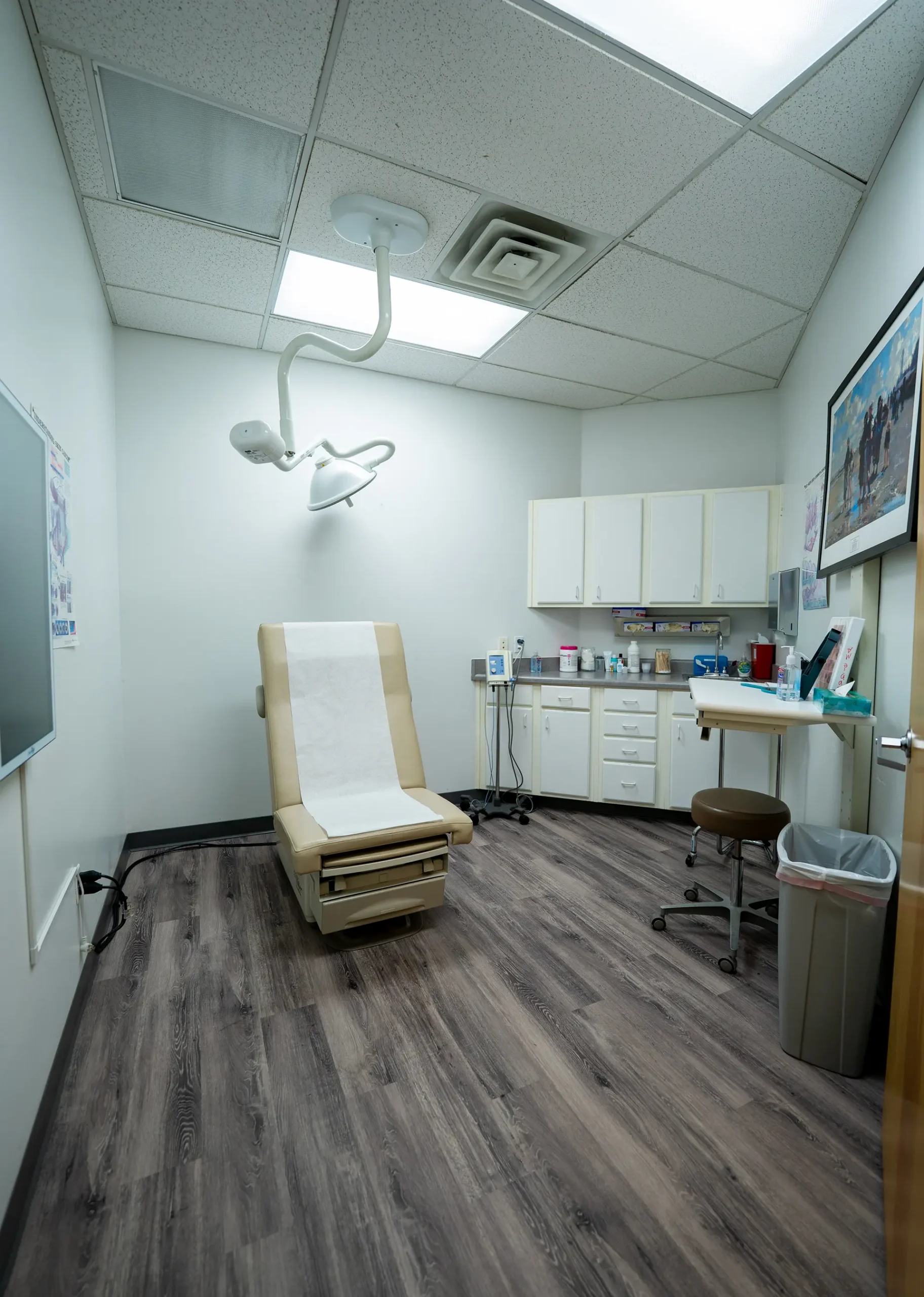 Medical Exam Room Prescott AZ Modern medical exam room by a custom home builder in Prescott AZ with exam table and built-in cabinetry