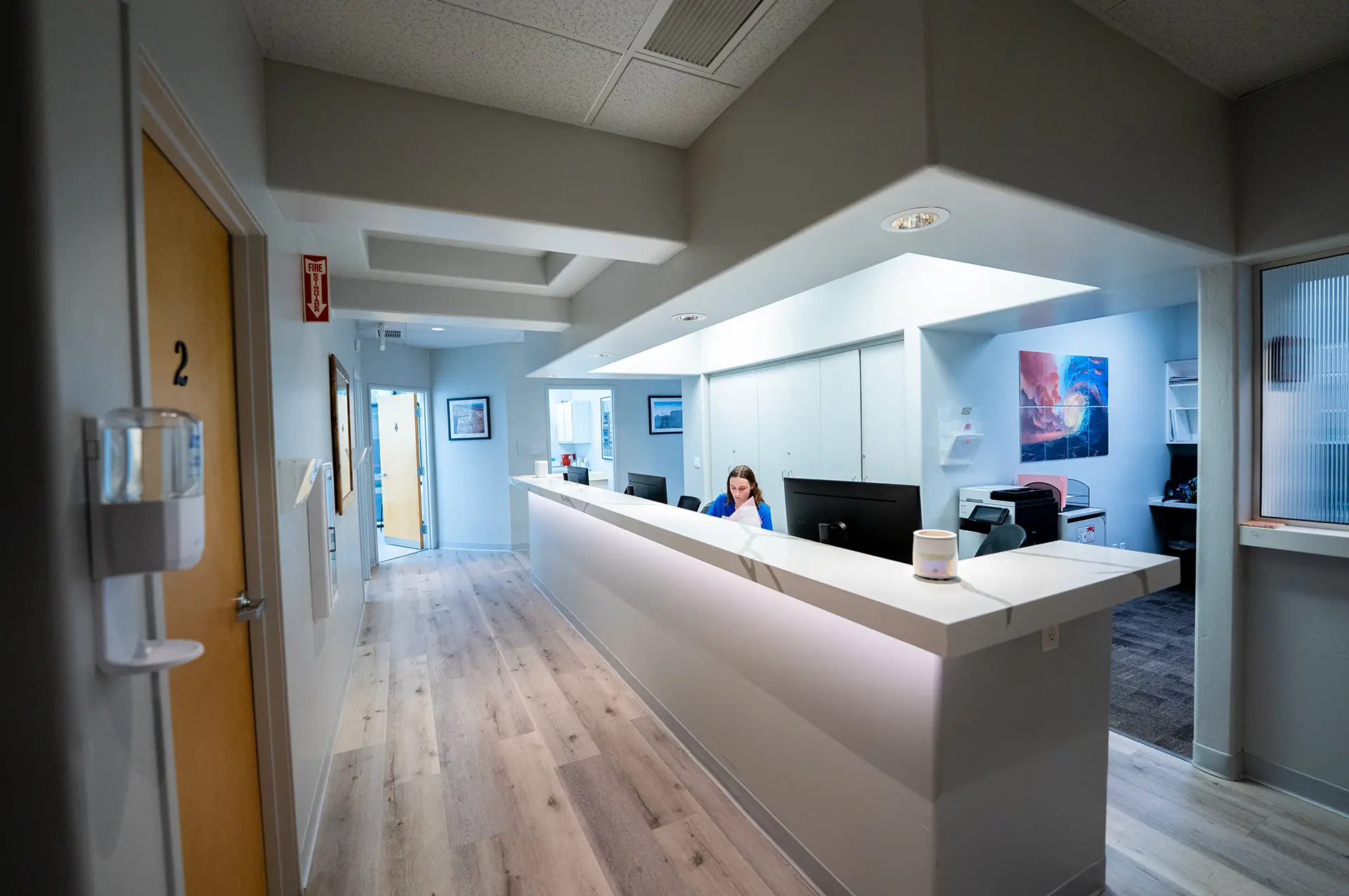 Medical Reception Prescott AZ Medical office reception by a custom home builder in Prescott AZ with modern reception desk and workspace